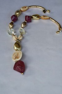 necklace with gold stones 26x32mm, ivory-colored nuts 20x28mm, ivory-colored coin 40mm, blackberry meteorit 35x41mm and purple rhombuses 29mm